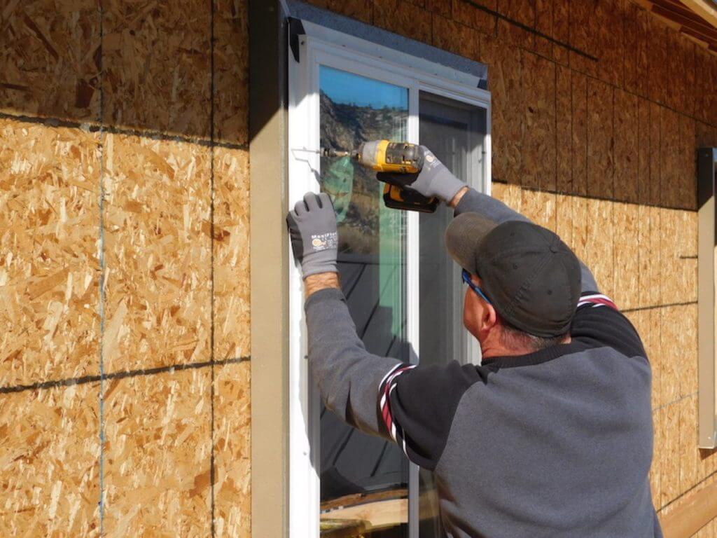Alpen Certified Installer attaching window into ThermalBuck